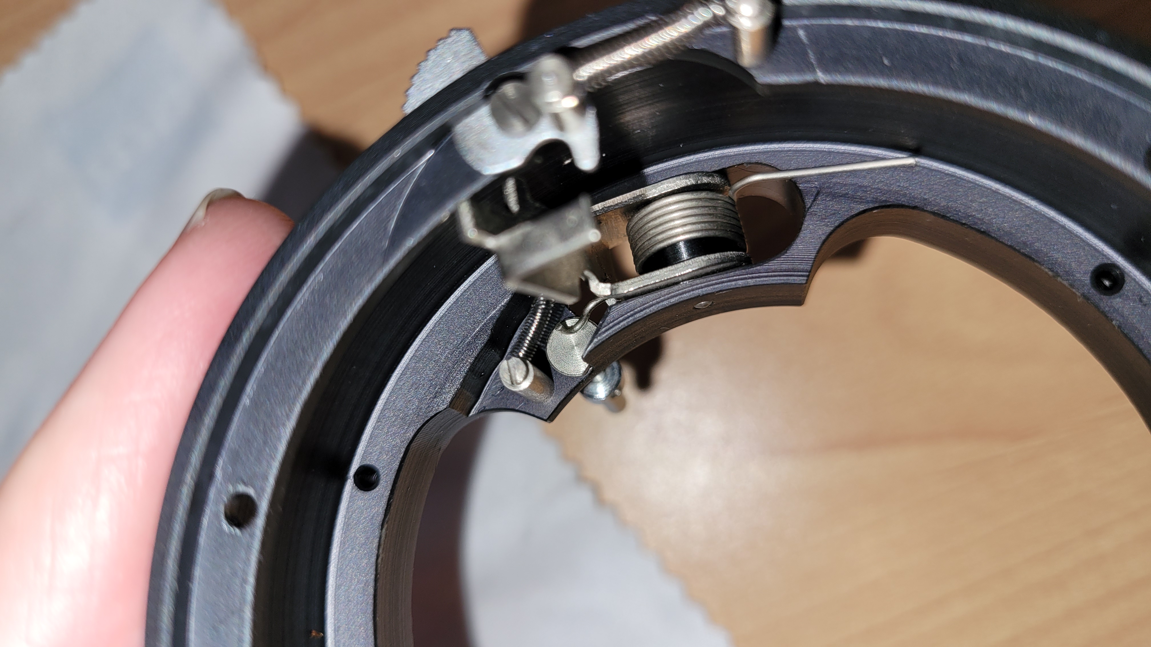 Front-side assembly of the name ring using the rubber friction tool